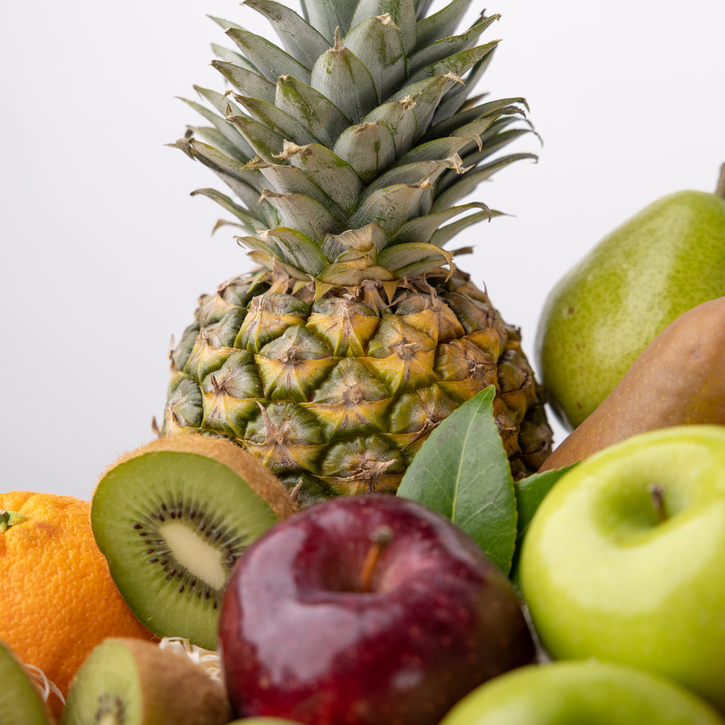 Extra large tropical fruit basket  Top down view of the Festival of Fruit Winter Basket and all of its content Festival of Fruit Gift Basket beautifully arranged with all of its content